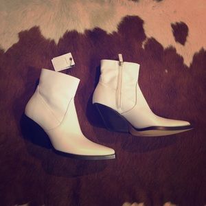 White leather ankle boots.